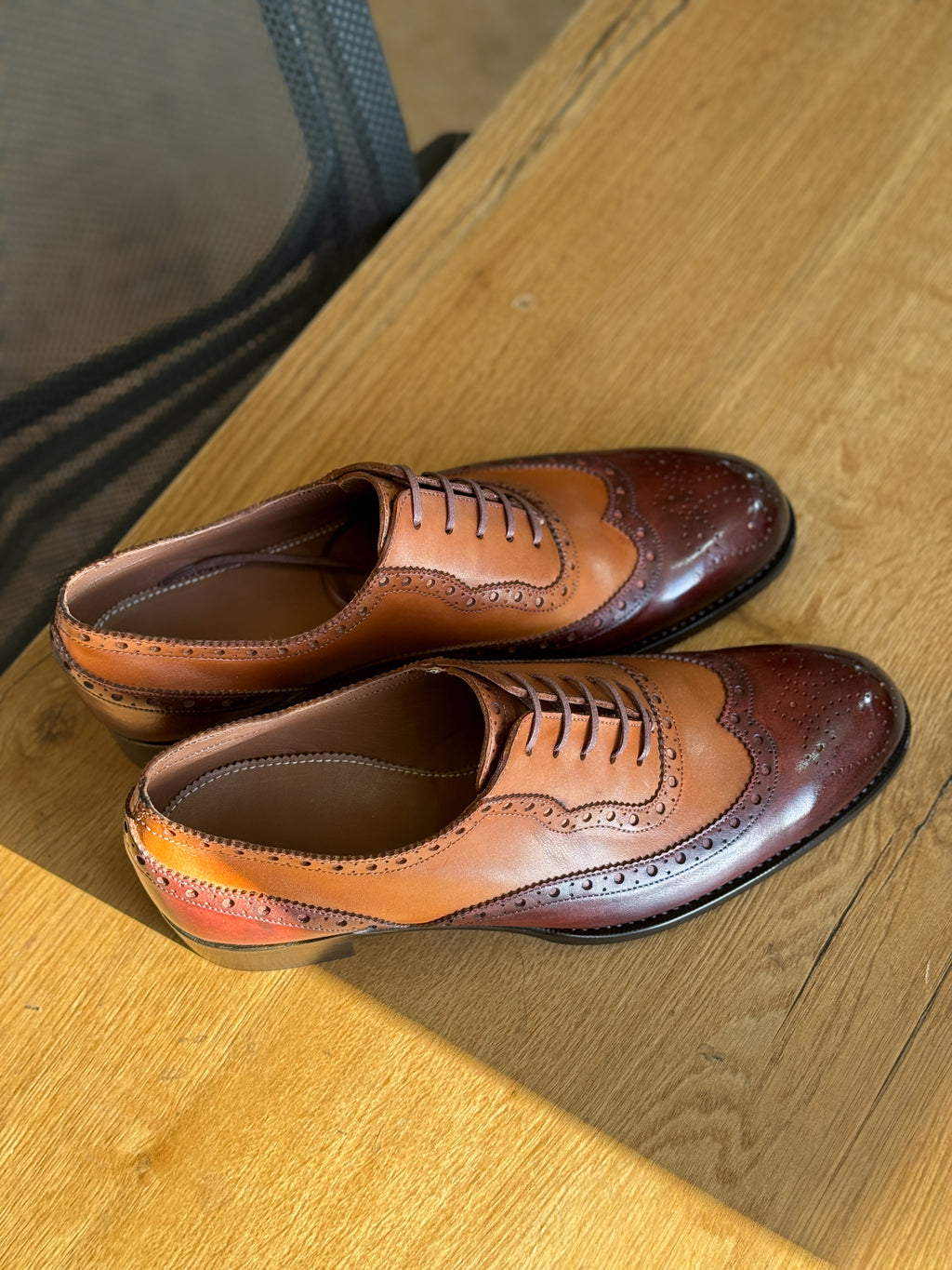 Burgundy chestnut wingtip oxfords