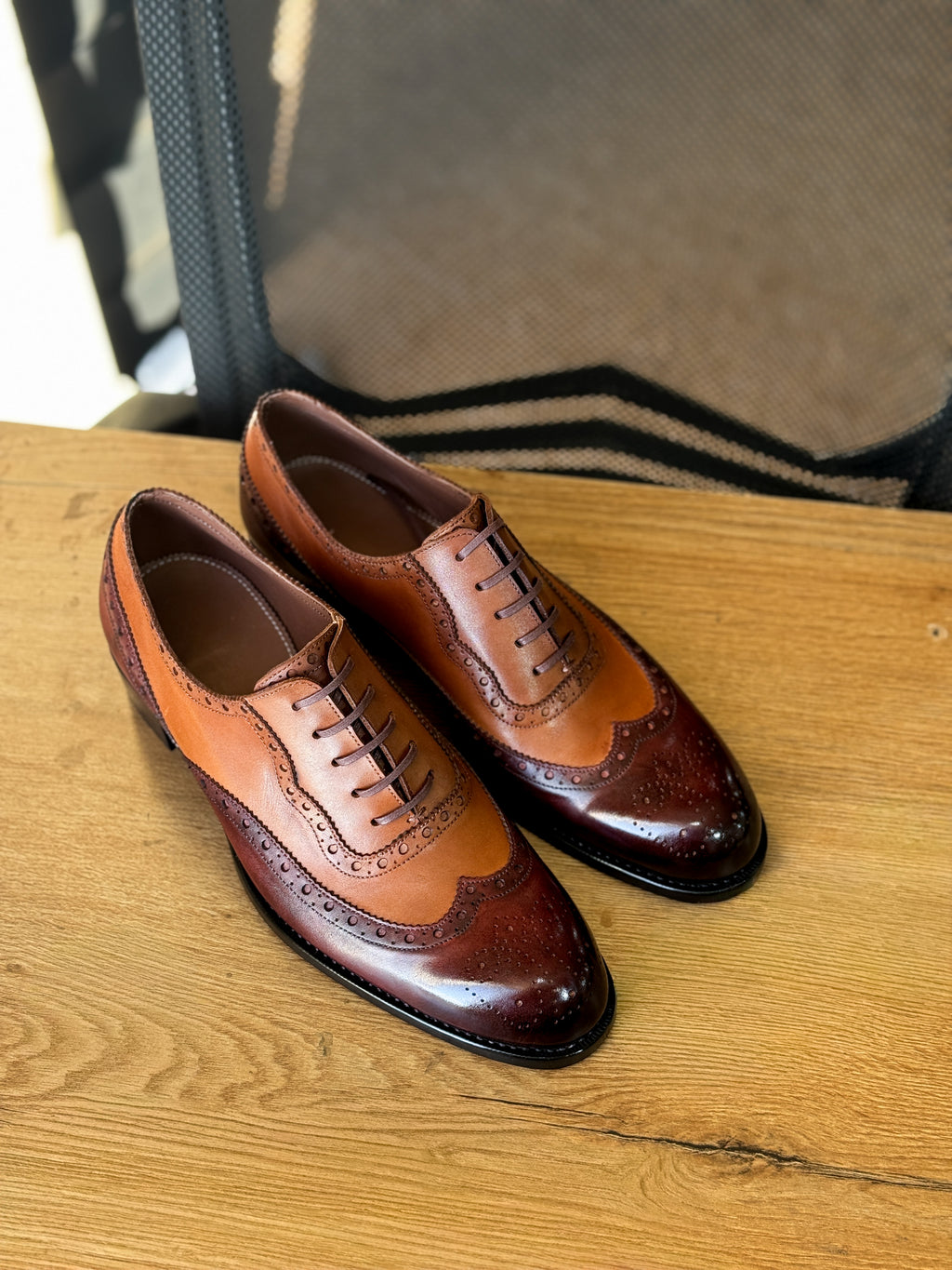Burgundy chestnut wingtip oxfords