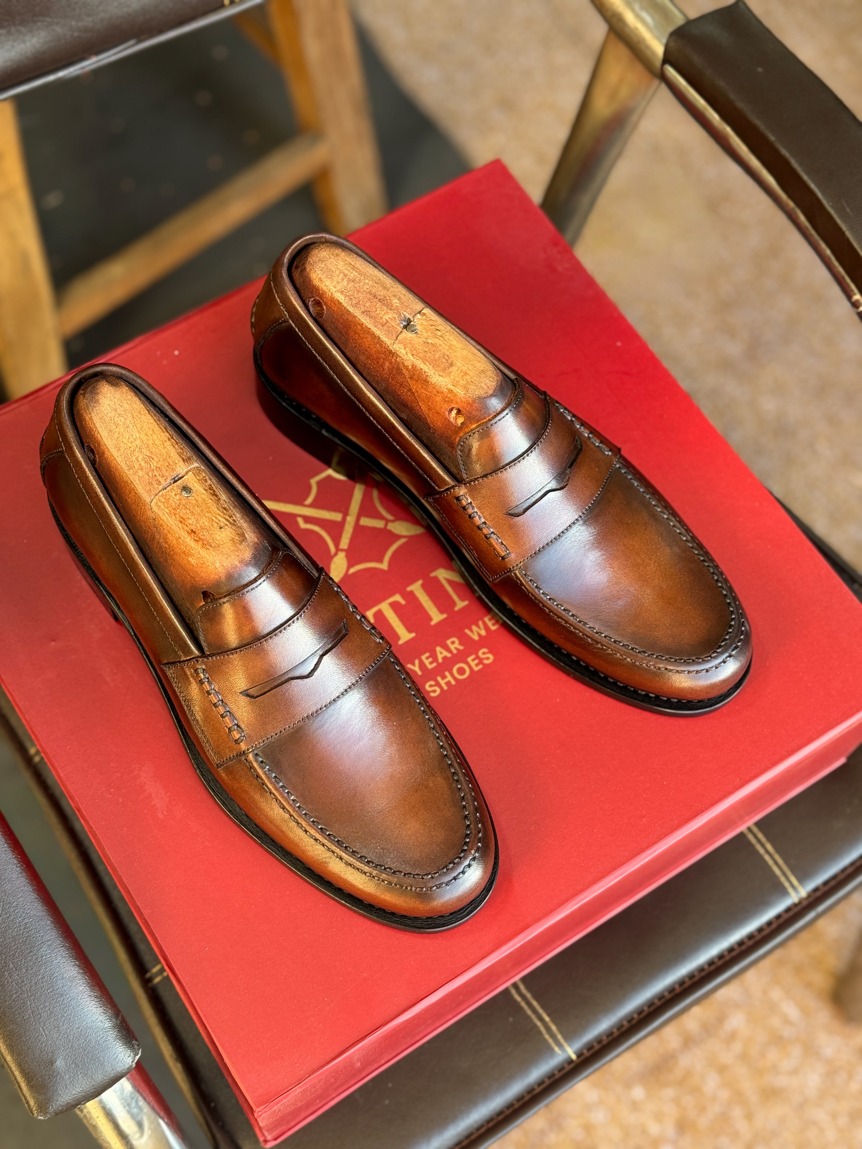 Brown patina penny loafers