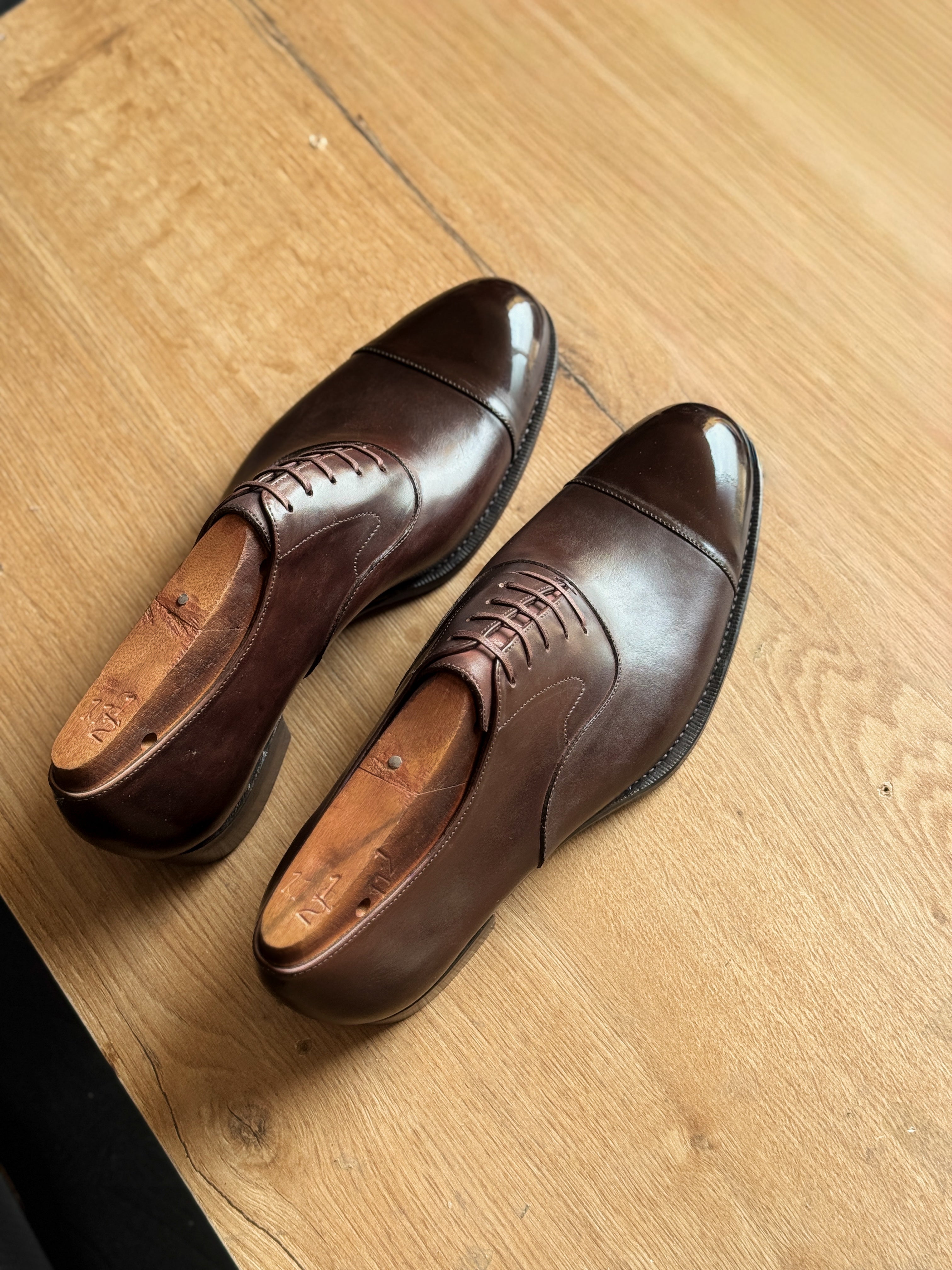 Dark brown cap-toe oxfords